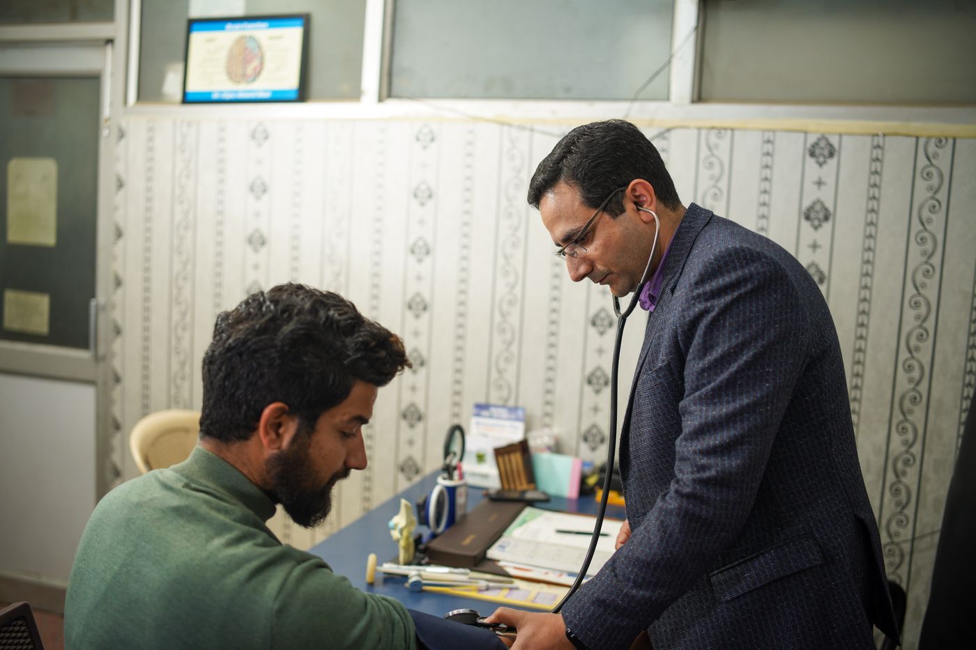 Doctor using a stethoscope during a heart health check-up