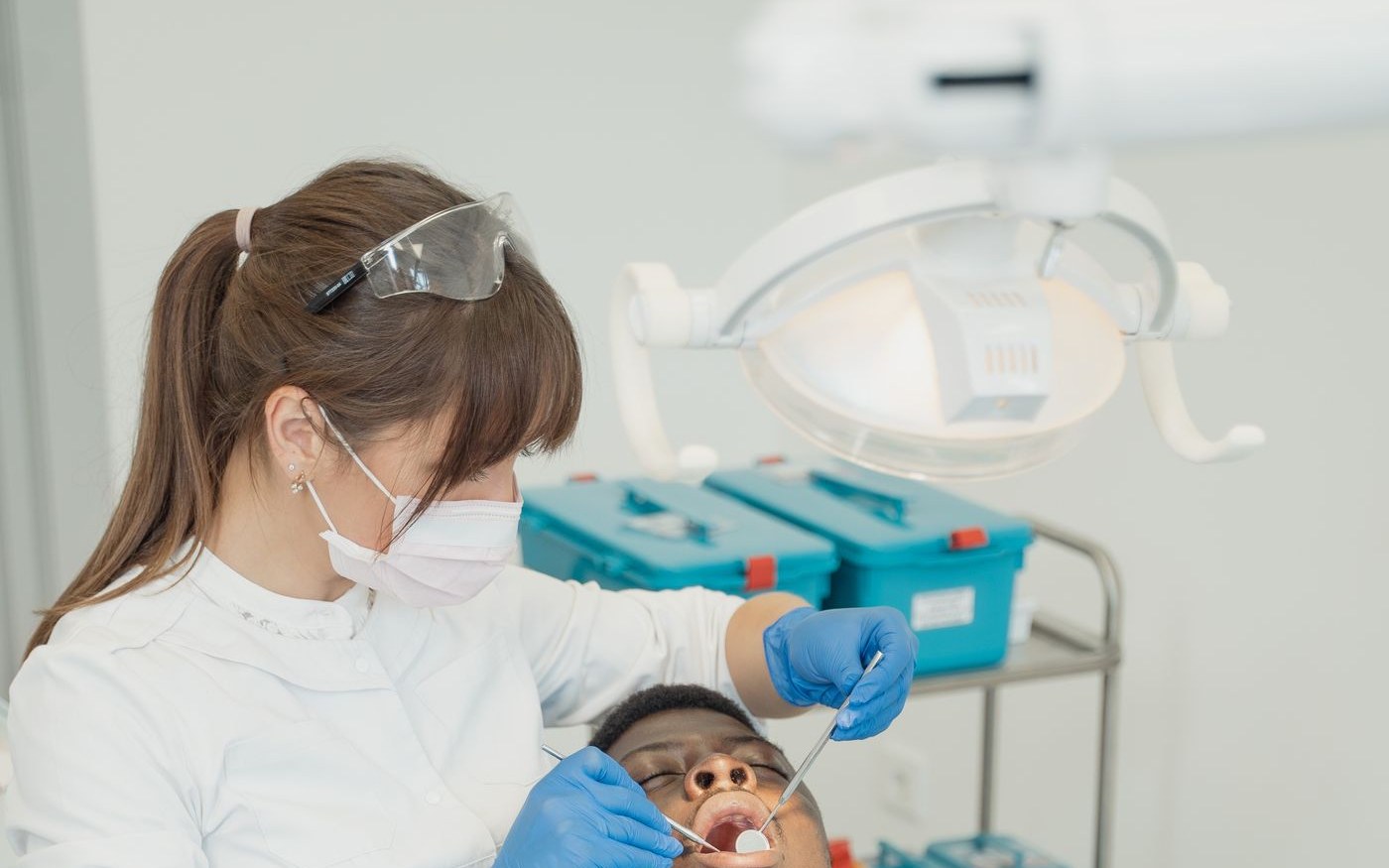 Dentist examining a patient's teeth in a dental clinic