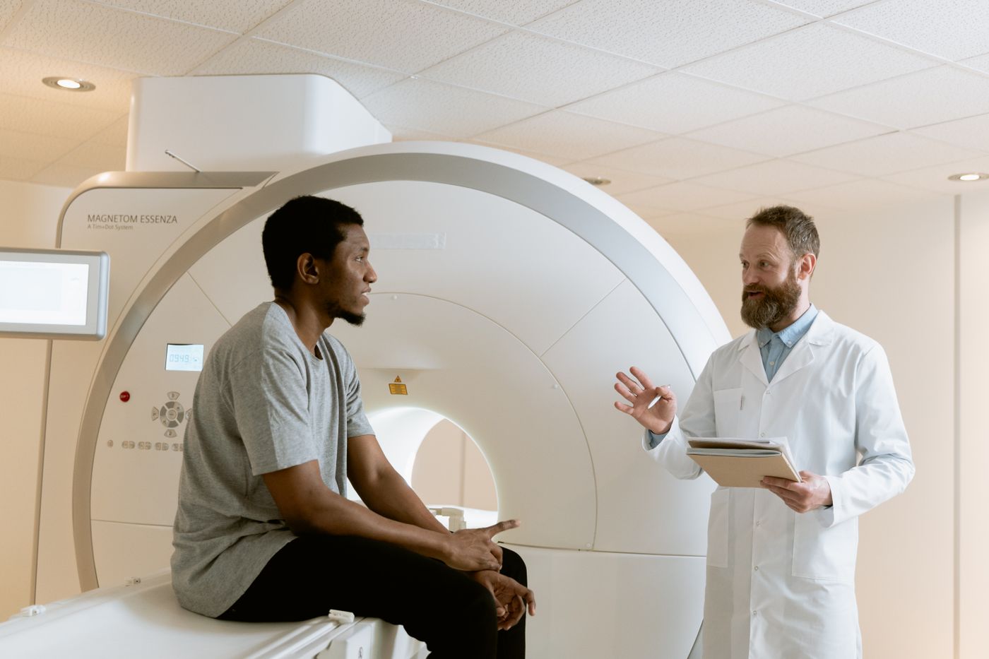 Doctor reviewing an MRI brain scan with a patient